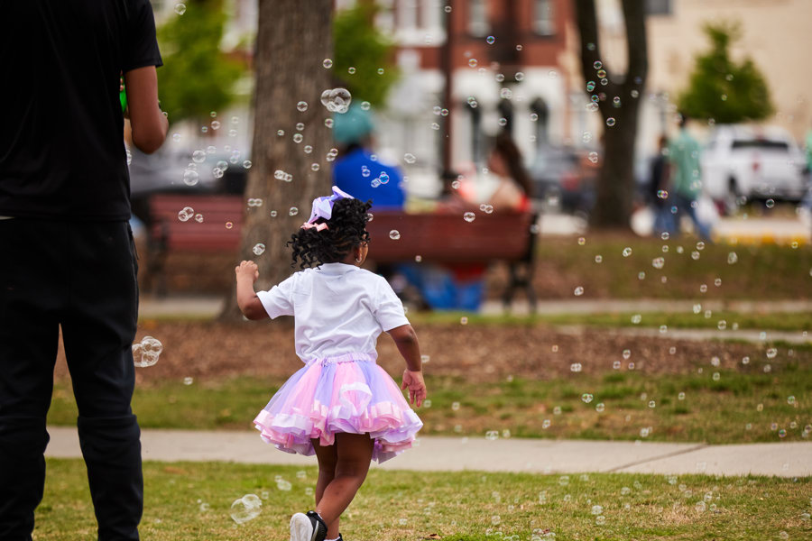 kid playing with bubbles